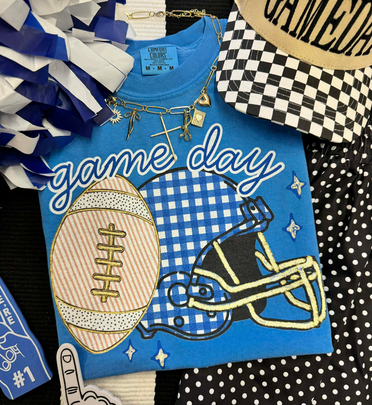 Blue gingham helmet tee by P&PD Wholesale, featuring a game day design, ideal for fans and casual wear.