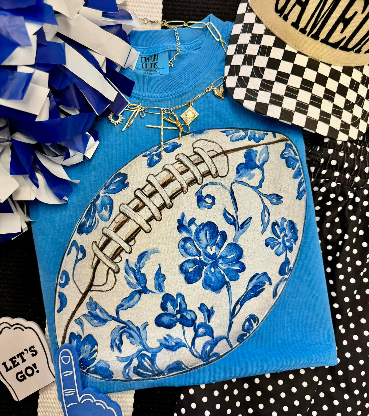 Royal Caribbean blue floral football tee by P&PD Wholesale, featuring a vibrant floral design on a sporty T-shirt.