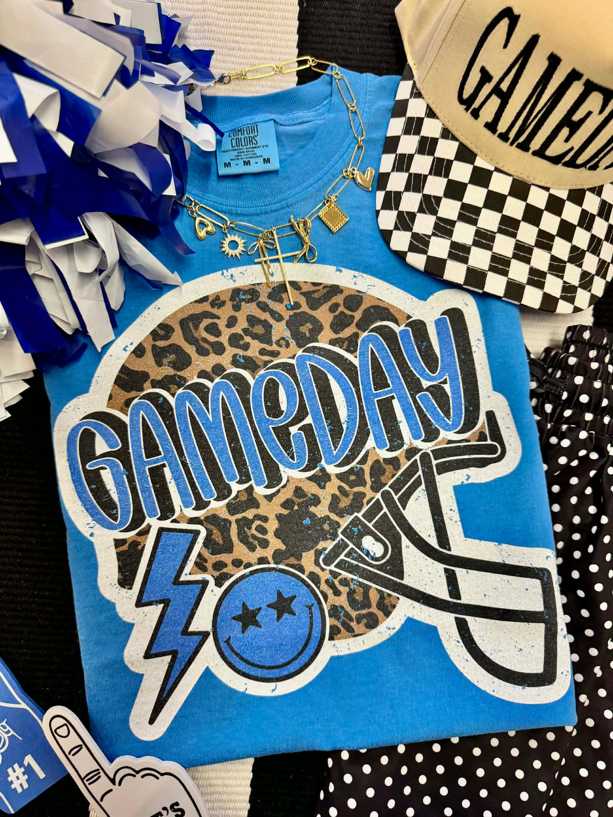 Blue Gameday Leopard Helmet T-shirt by P&PD Wholesale featuring a sporty helmet graphic on a casual tee.