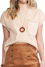Shewin oatmeal patch pocket ribbed knit short sleeve sweater, cozy and casual, shown on a model in a neutral setting.