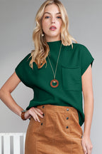 Shewin oatmeal patch pocket ribbed knit short sleeve sweater, close-up of beige knit fabric with pocket detail.