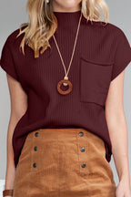 Shewin oatmeal patch pocket ribbed knit short sleeve sweater, close-up of beige knit fabric with patch pocket and ribbed design.
