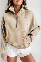 Brown zip-up sweatshirt with stand collar and thumbhole sleeves by Shewin, casual and comfortable for everyday wear.