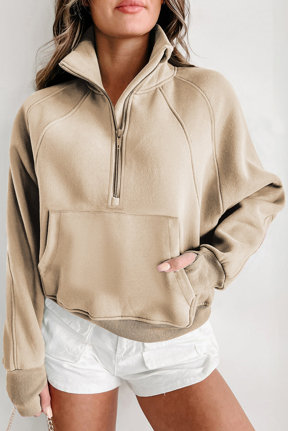 Brown zip-up sweatshirt with stand collar and thumbhole sleeves by Shewin, casual and comfortable for everyday wear.