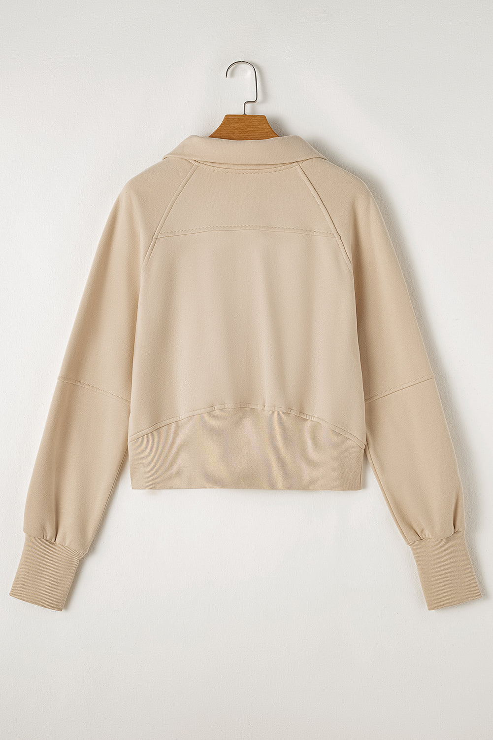 Brown zip-up sweatshirt by Shewin with stand collar and thumbhole sleeves, casual and comfortable for everyday wear.