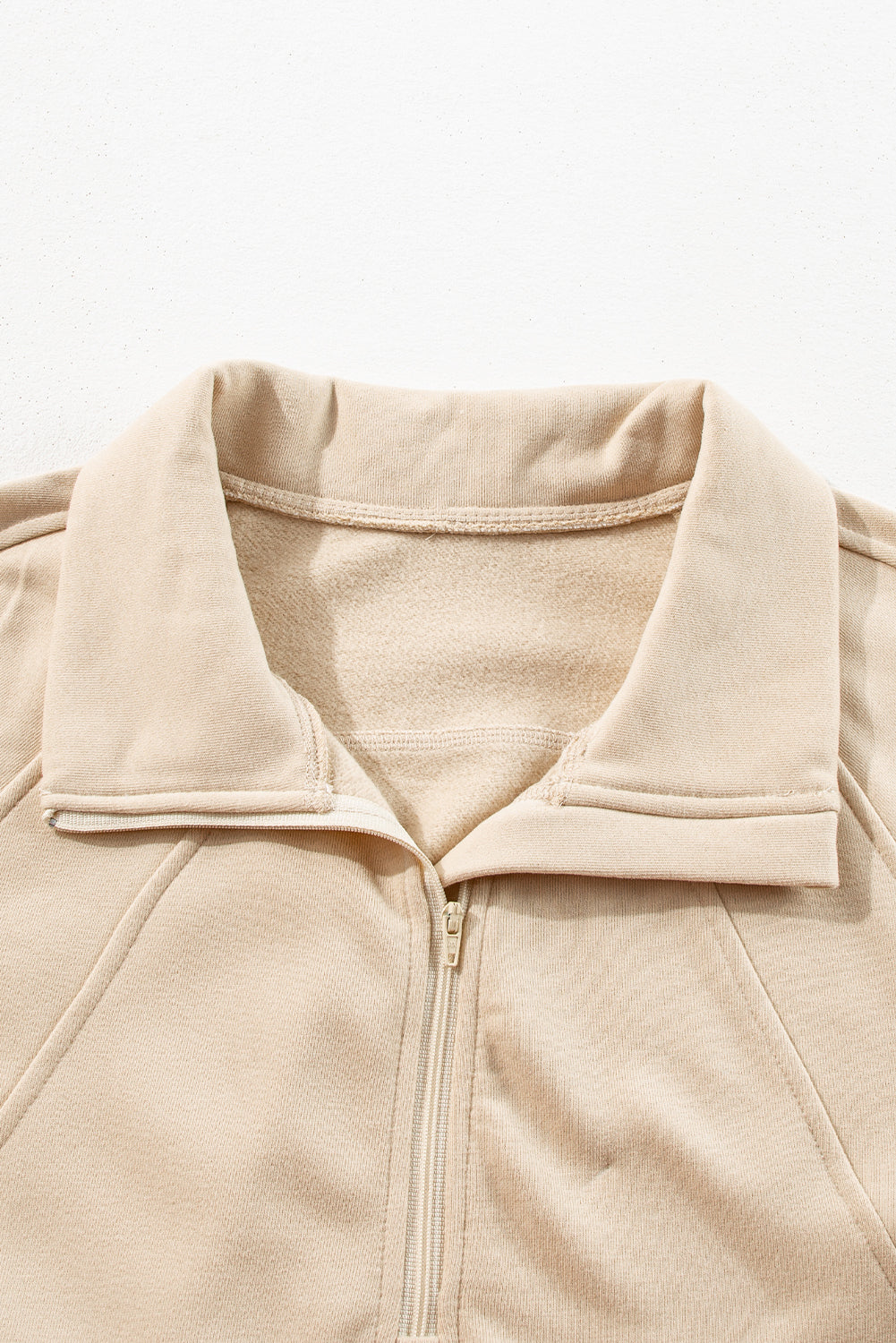 Brown zip-up sweatshirt with stand collar and thumbhole sleeves by Shewin, casual and comfortable for everyday wear.