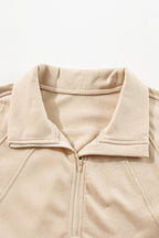 Brown zip-up sweatshirt with stand collar and thumbhole sleeves by Shewin, casual and comfortable for everyday wear.
