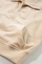 Brown zip-up sweatshirt with stand collar and thumbhole sleeves by Shewin, casual and cozy hoodie for everyday wear.