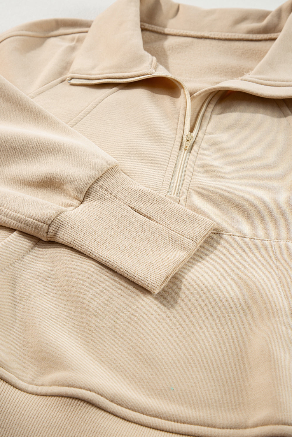 Brown zip-up sweatshirt with stand collar and thumbhole sleeves by Shewin, casual and cozy for everyday wear.