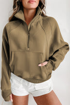 Brown zip-up sweatshirt with stand collar and thumbhole sleeves by Shewin, casual and stylish for everyday wear.