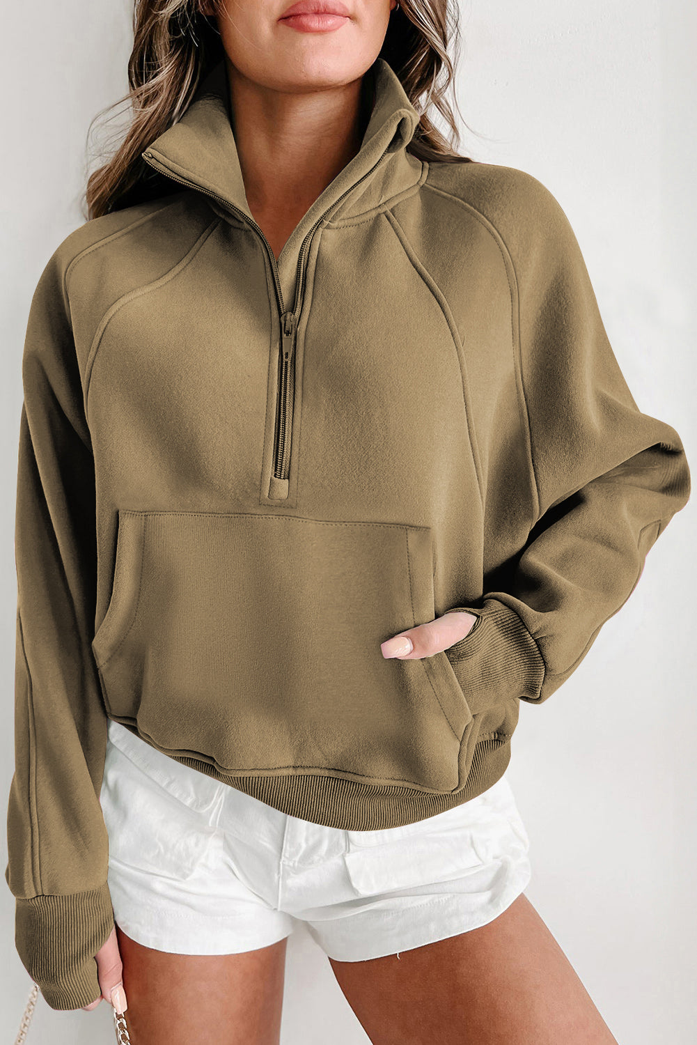 Brown zip-up sweatshirt with stand collar and thumbhole sleeves by Shewin, casual and stylish for everyday wear.
