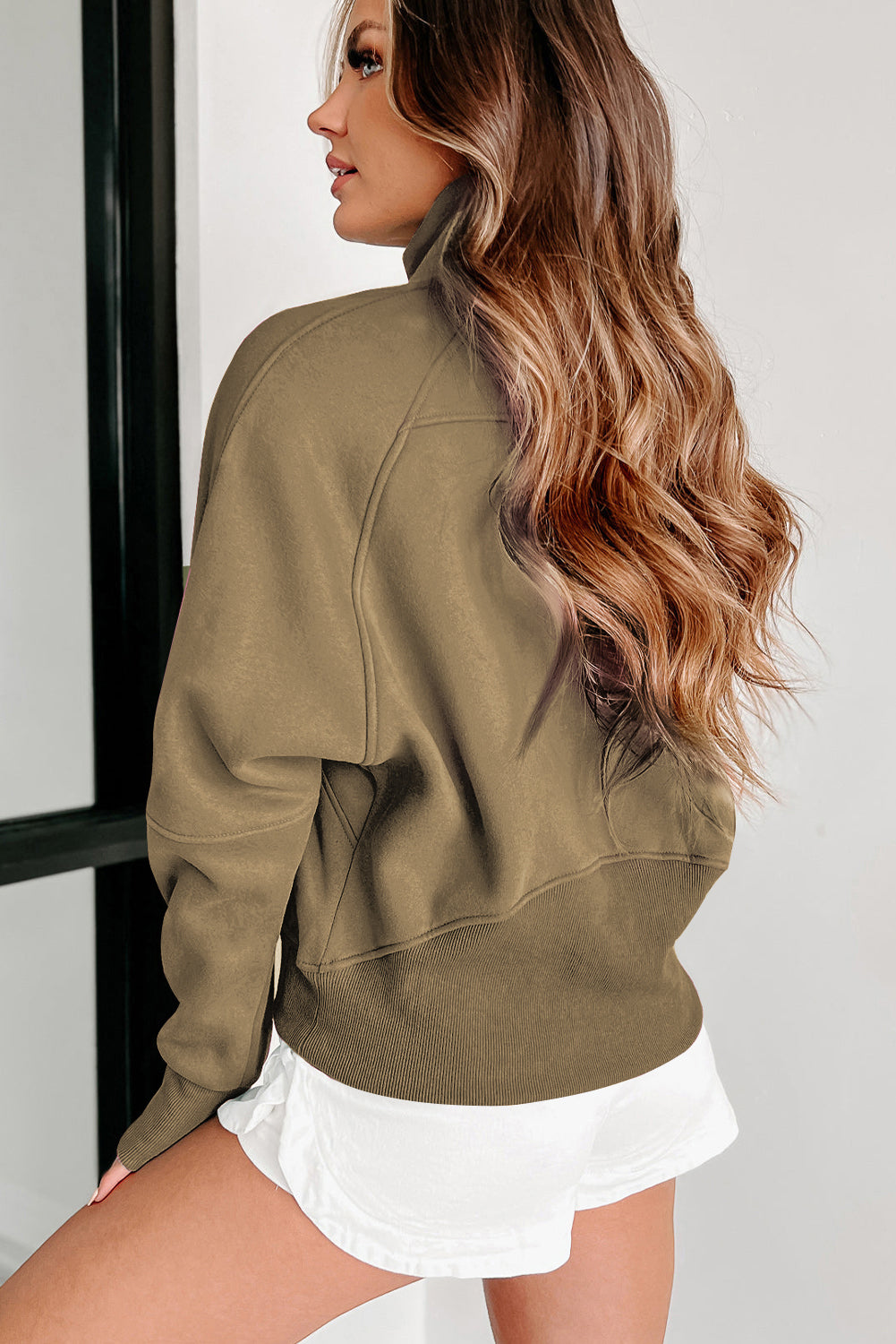 Brown zip-up sweatshirt with stand collar and thumbhole sleeves from Shewin, casual and comfortable for everyday wear.