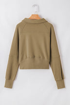 Brown zip-up sweatshirt by Shewin with stand collar and thumbhole sleeves, casual and comfortable for everyday wear.