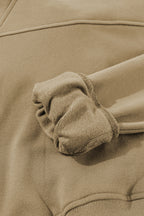 Brown zip-up sweatshirt with stand collar and thumbhole sleeves by Shewin, casual and cozy for everyday wear.