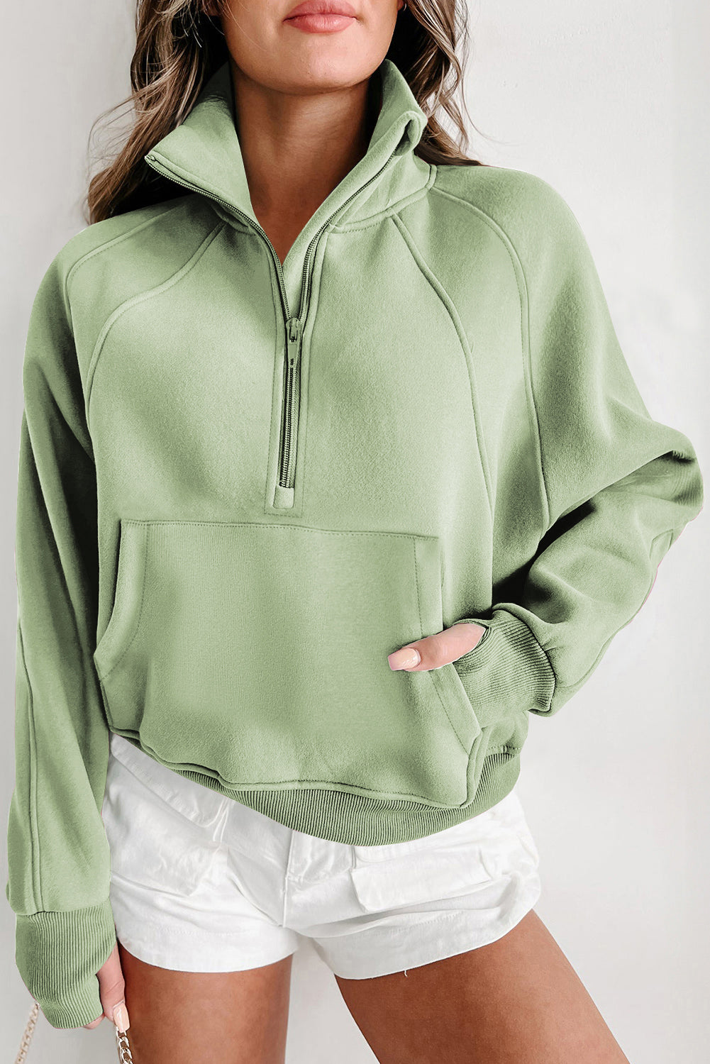 Brown zip-up sweatshirt with stand collar and thumbhole sleeves by Shewin, casual and comfortable for everyday wear