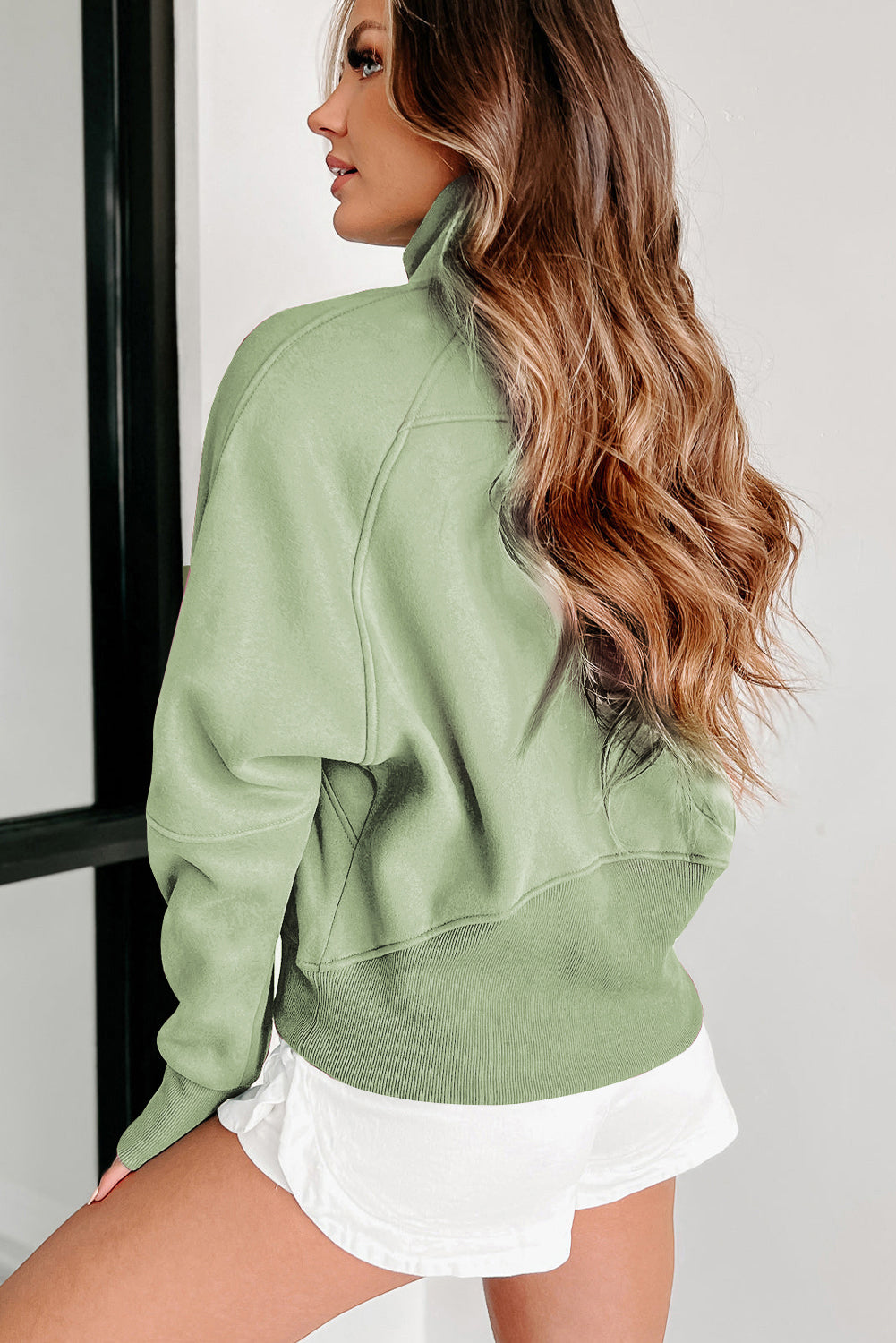 Brown zip-up sweatshirt with stand collar and thumbhole sleeves by Shewin, casual and comfortable for everyday wear.