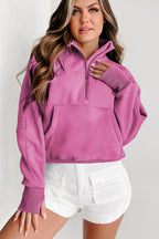 Brown zip-up sweatshirt with stand collar and thumbhole sleeves by Shewin, casual and comfortable for everyday wear.