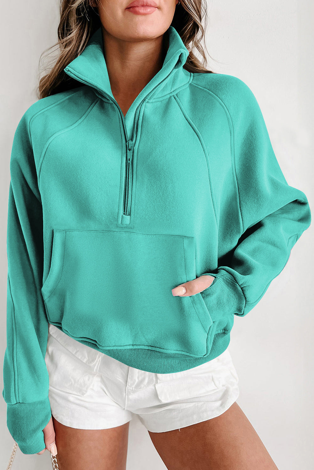 Brown zip-up sweatshirt with stand collar and thumbhole sleeves by Shewin, featuring a casual, comfortable design.
