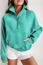 Brown zip-up sweatshirt with stand collar and thumbhole sleeves by Shewin, featuring a casual, comfortable design.