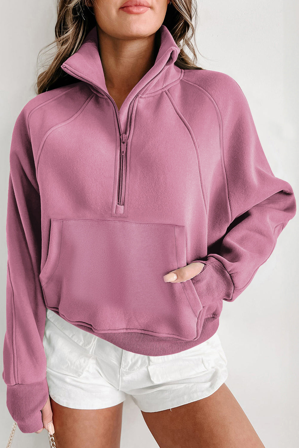 Brown zip-up sweatshirt with stand collar and thumbhole sleeves by Shewin, featuring a casual and comfortable fit.