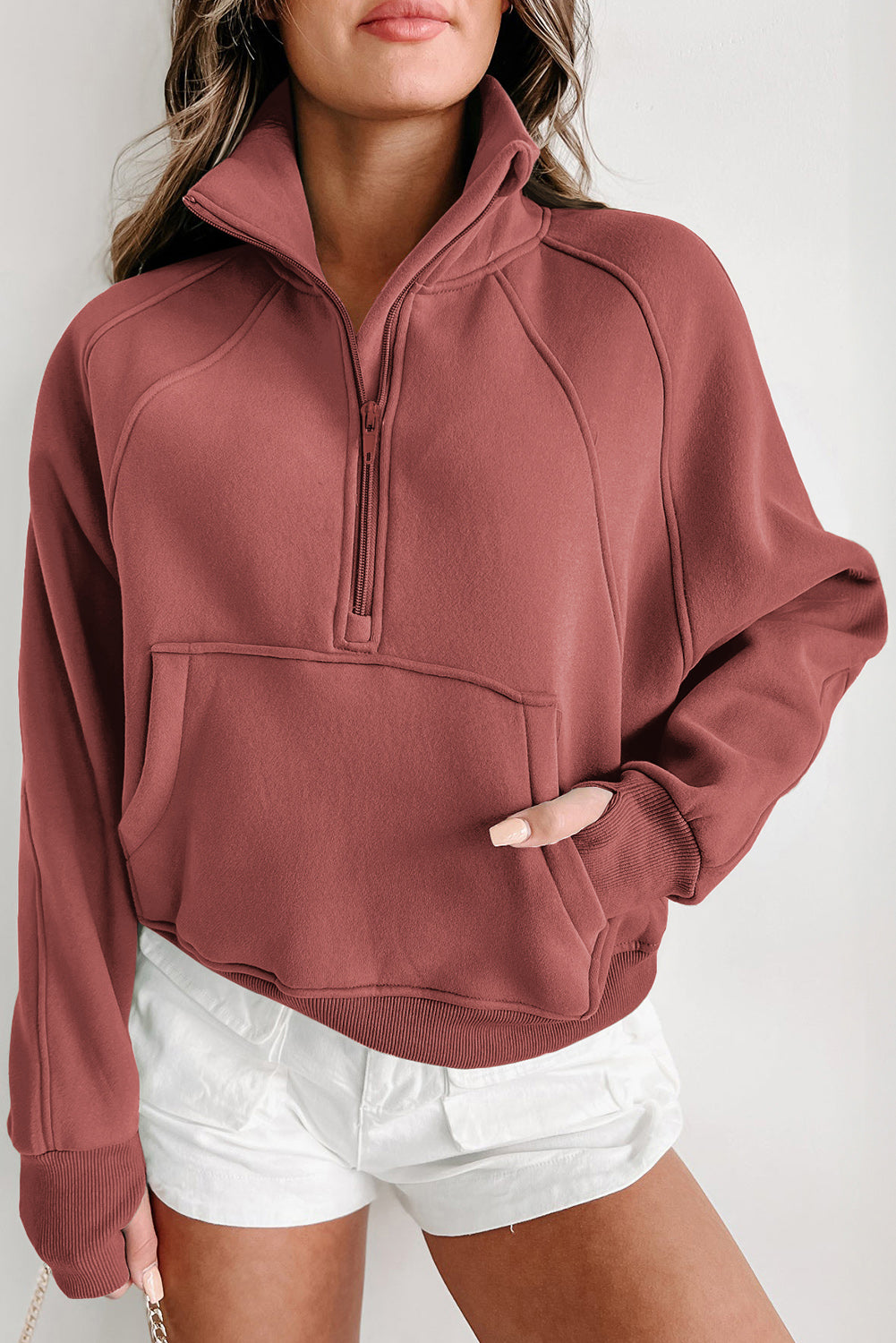 Brown zip-up sweatshirt with stand collar and thumbhole sleeves by Shewin, casual and comfortable for everyday wear.