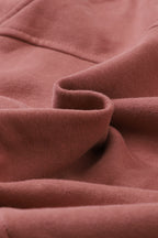 Brown zip-up sweatshirt with stand collar and thumbhole sleeves by Shewin, casual and comfortable for everyday wear.