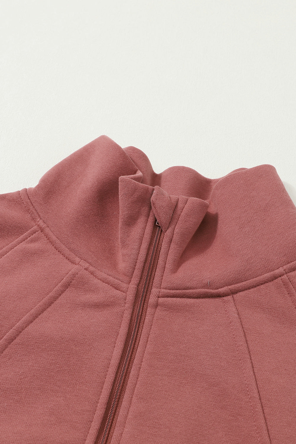 Brown zip-up sweatshirt with stand collar and thumbhole sleeves from Shewin, casual and comfortable for everyday wear.