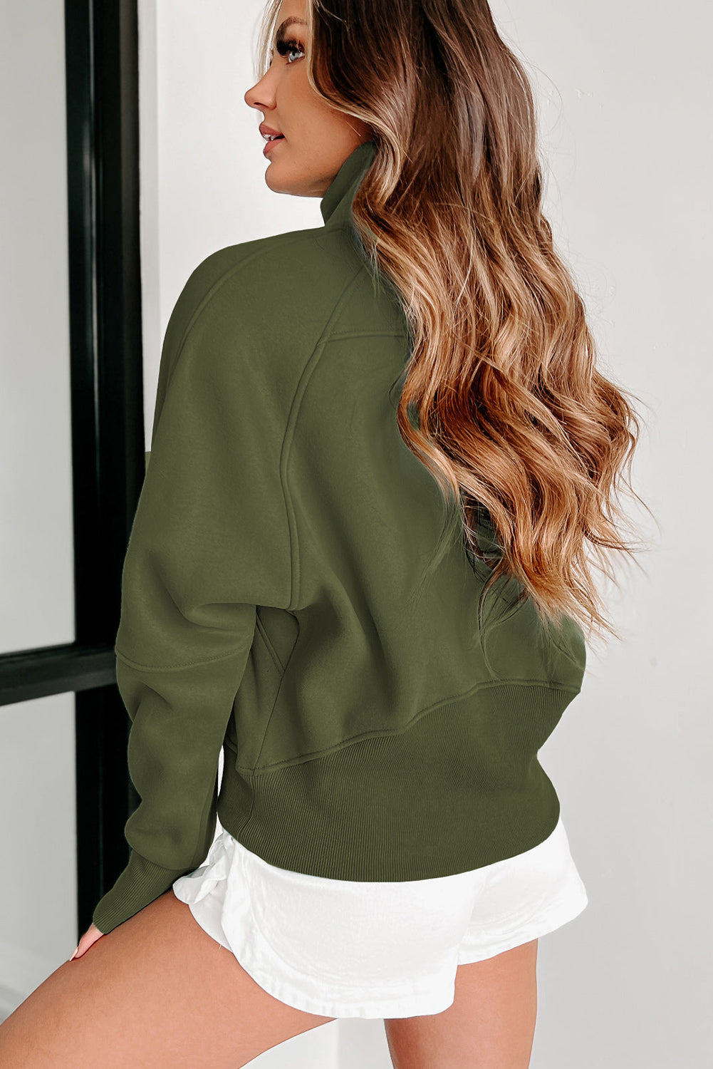 Brown zip-up sweatshirt with stand collar and thumbhole sleeves by Shewin, casual and comfortable for everyday wear.