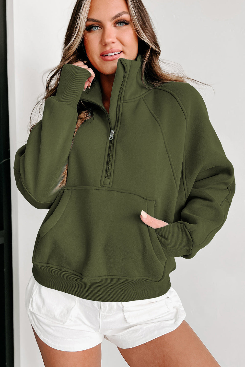 Brown zip-up sweatshirt with stand collar and thumbhole sleeves by Shewin, casual and cozy for everyday wear