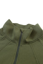 Brown zip-up sweatshirt with stand collar and thumbhole sleeves by Shewin, casual and comfortable for everyday wear.
