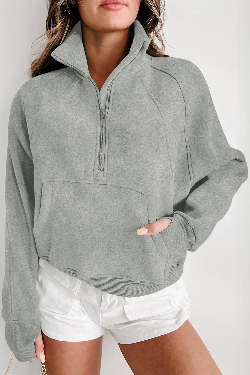 Brown zip-up sweatshirt with stand collar and thumbhole sleeves by Shewin, casual and comfortable for everyday wear