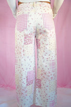 Starstruckd pink floral and gingham patchwork jeans with colorful floral and checkered fabric details.