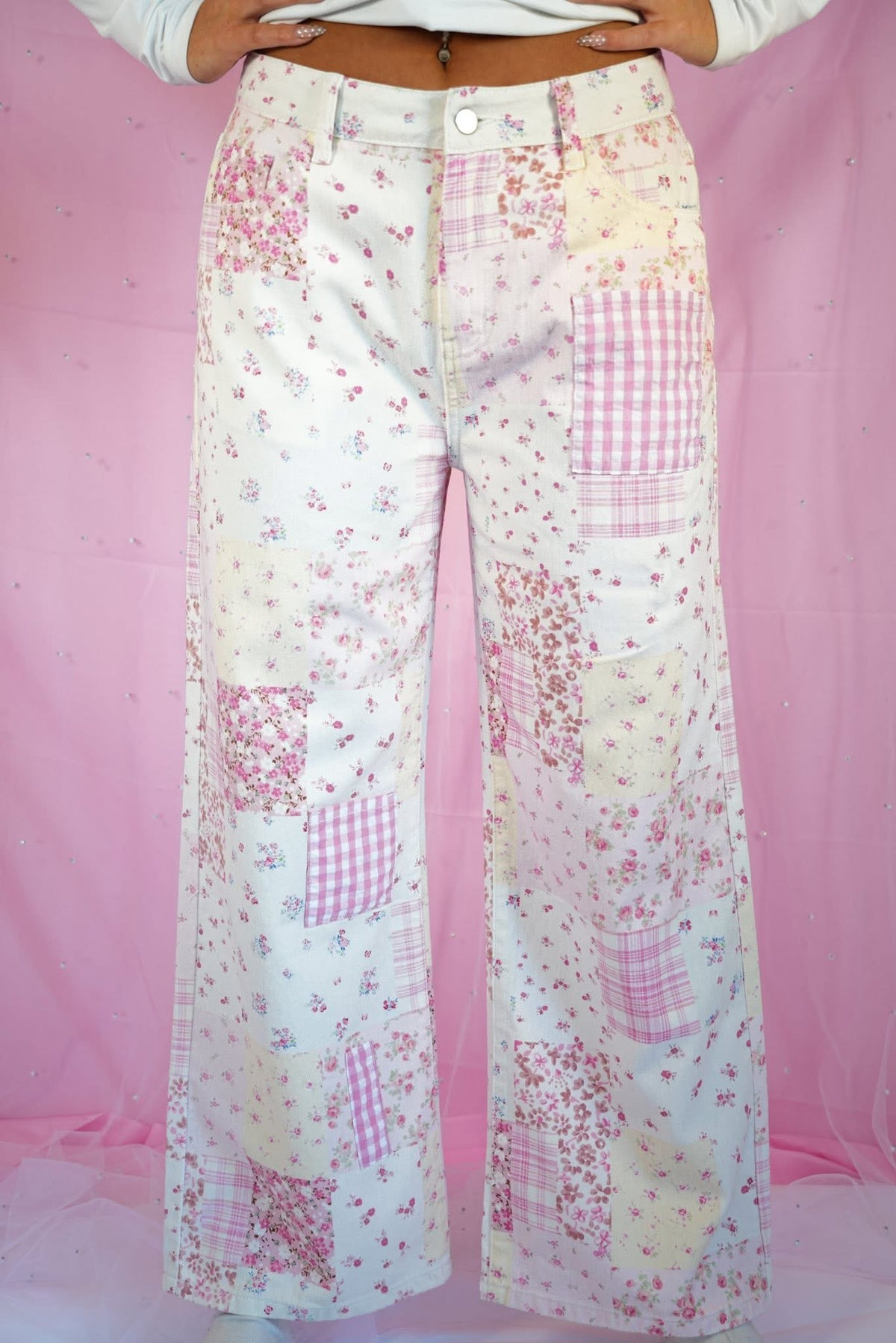 Starstruckd pink floral and gingham patchwork jeans featuring colorful floral and checkered fabric design.