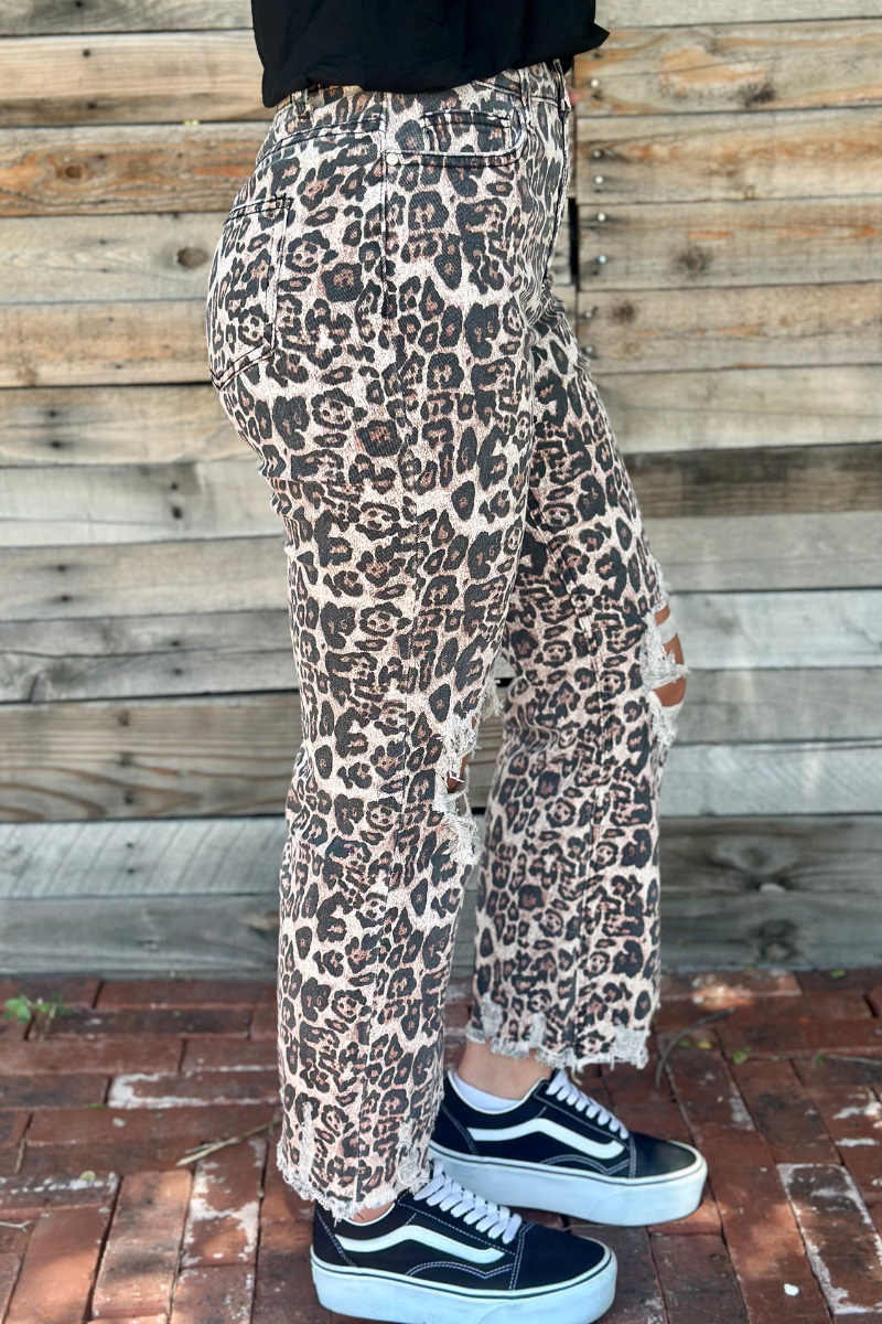 Sterling Kreek Hear Me Roar jeans featuring a denim design with a fierce animal print and trendy fit.