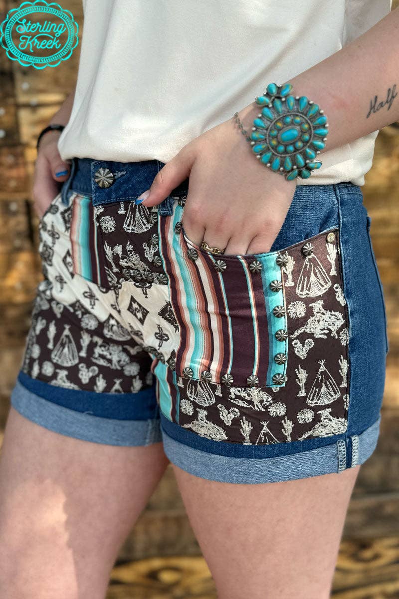 Sterling Kreek Patched Up Western Long Shorts with distressed denim and patchwork details, casual style for everyday wear.