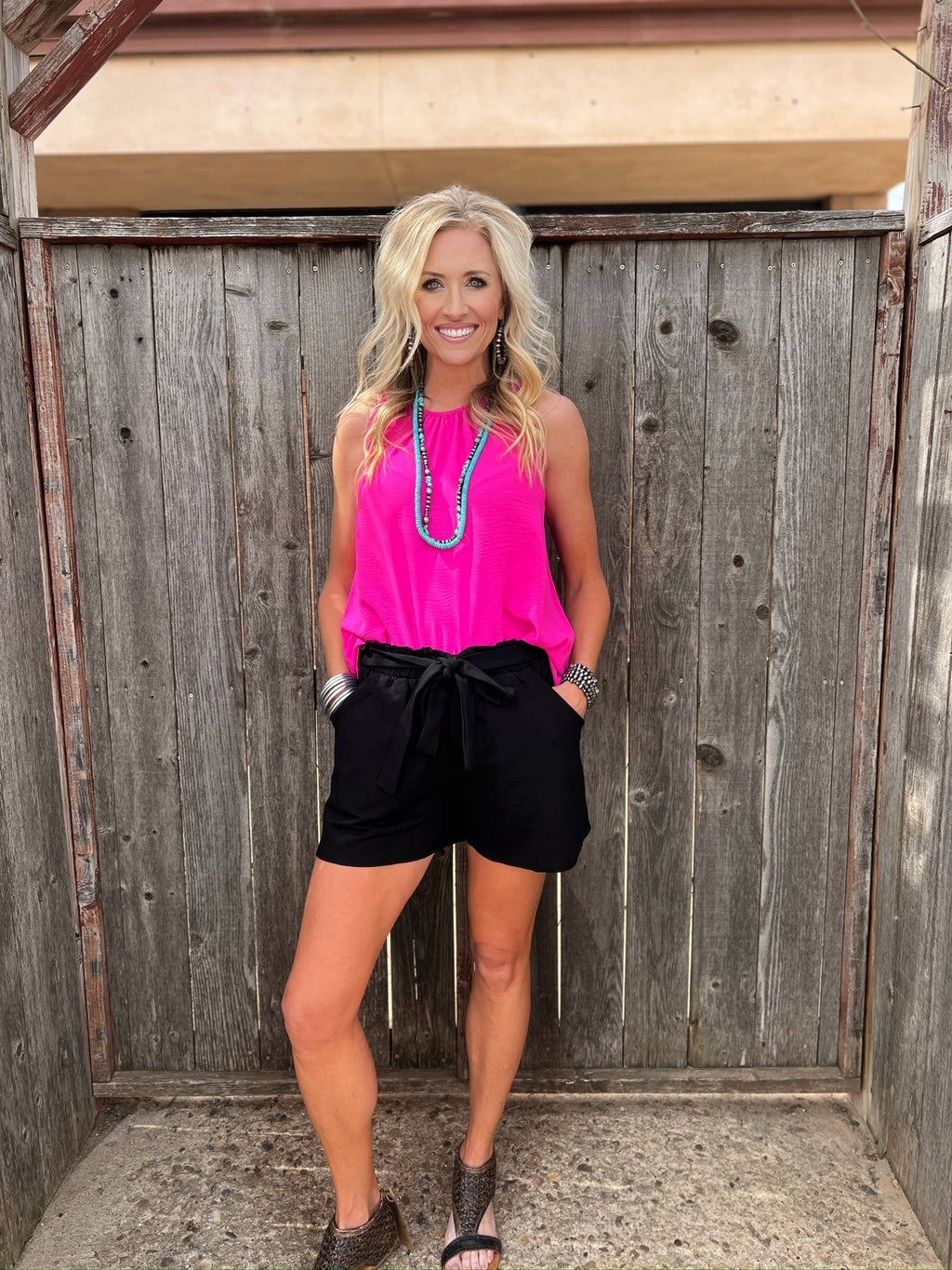 Black Brenna tie-waist shorts by Texas True Threads, stylish bottoms with a comfortable fit, shown on a model.