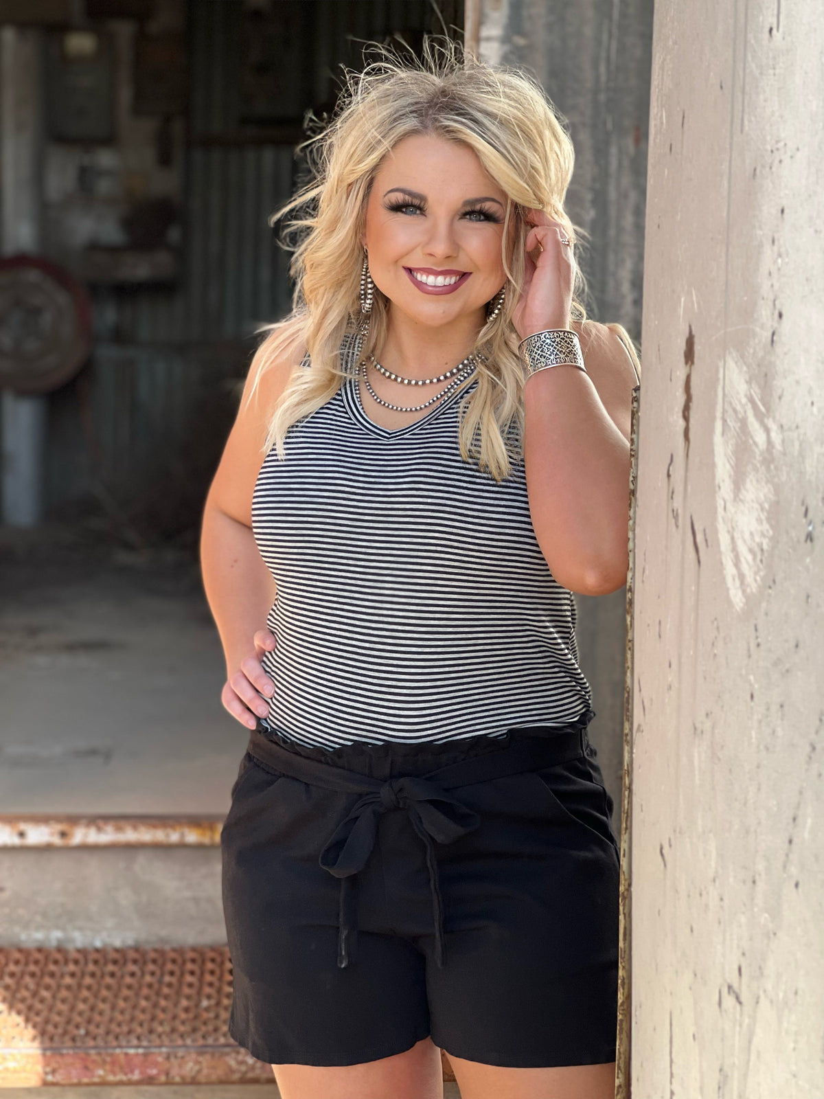 Black Brenna tie-waist shorts by Texas True Threads, stylish bottoms with a flattering fit and adjustable waist detail.