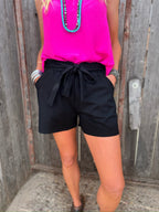 Black Brenna tie-waist shorts by Texas True Threads, casual bottoms with a comfortable fit and stylish design.