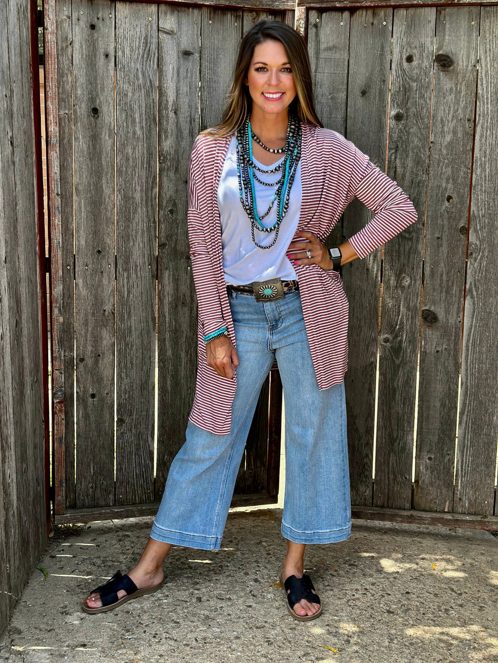 Mauve striped mid-length cardigan sweater by Texas True Threads, featuring a cozy knit with vertical stripe pattern.