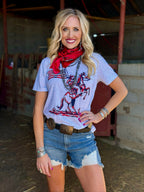 White patriotic cowboy T-shirt by Texas True Threads featuring a bold cowboy design and festive red, white, and blue accents.