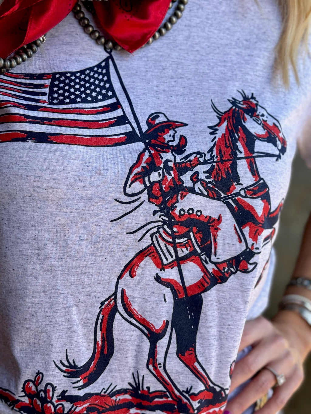 White Patriotic Cowboy Tee by Texas True Threads featuring a patriotic cowboy design on front.