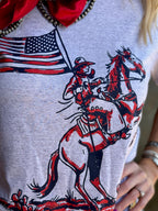 White Patriotic Cowboy Tee by Texas True Threads featuring a patriotic cowboy design on front.