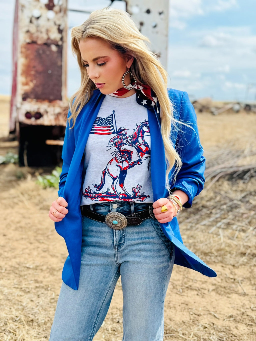 White patriotic cowboy tee by Texas True Threads featuring a bold western-themed design on the front.