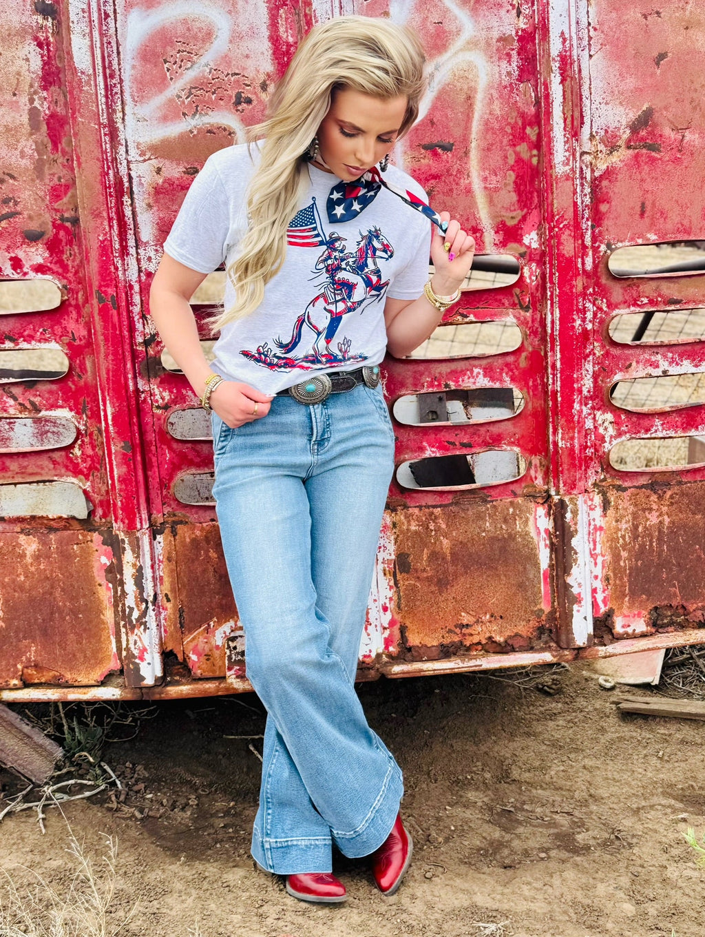 White patriotic cowboy T-shirt by Texas True Threads featuring a cowboy graphic and American flag design.