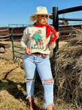 Sunset Cowboy sweatshirt by Texas True Threads featuring a cowboy silhouette and sunset design on a soft tee.