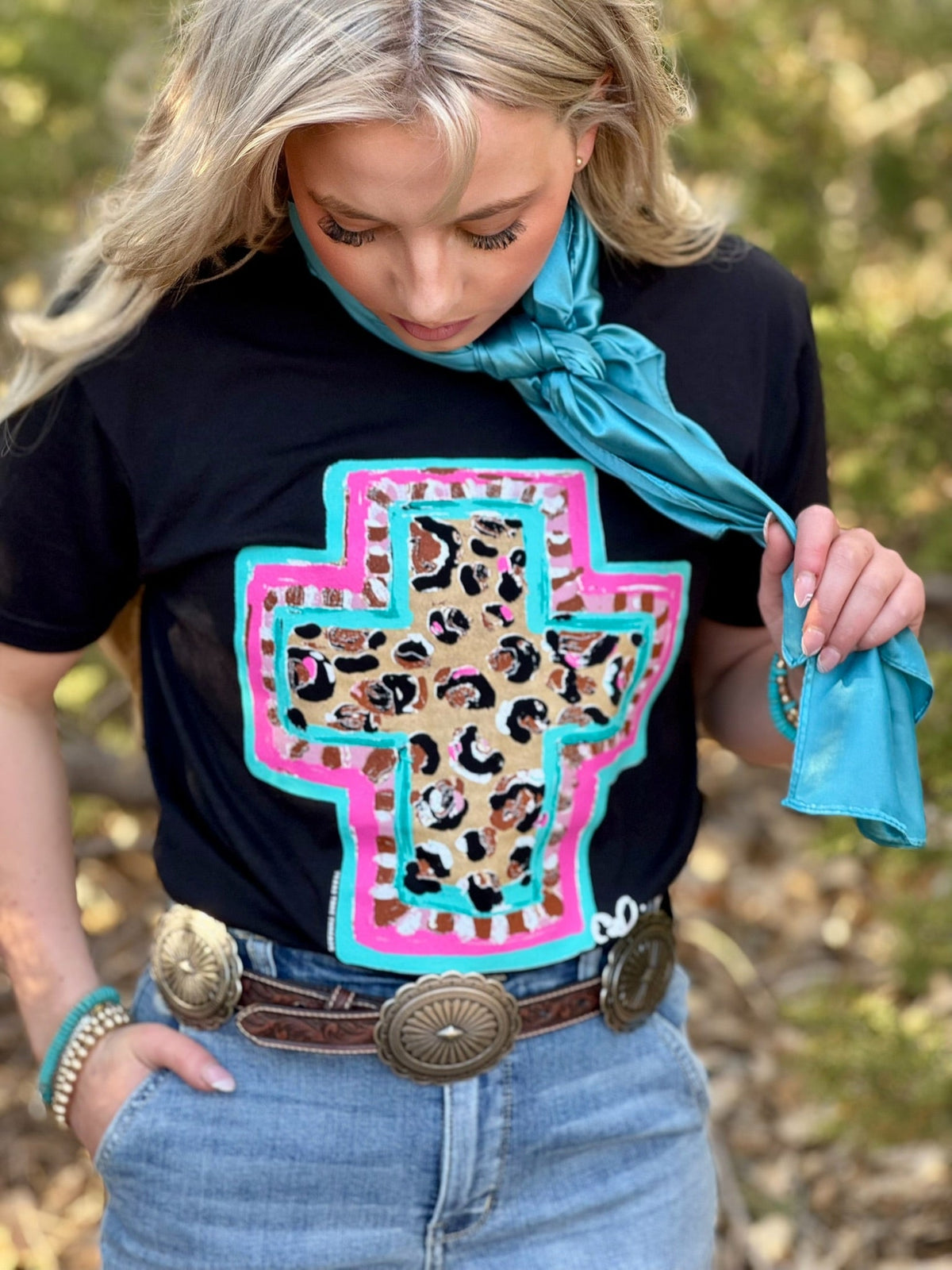 Black Callie Ann Stelter Spring Time Leopard Cross T-shirt from Texas True Threads, featuring a leopard cross design on the front.