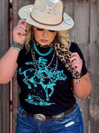 Texas True Threads Roughrider turquoise puff tee, black crew neck T-shirt with graphic design, casual unisex style.