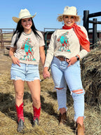Heather tan Sunset Cowboy Tee by Texas True Threads featuring a cowboy sunset graphic on a casual tee.