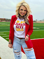 White crew neck T-shirt by Texas True Threads featuring "In My Kansas City Era" by Randi Mahomes graphic.