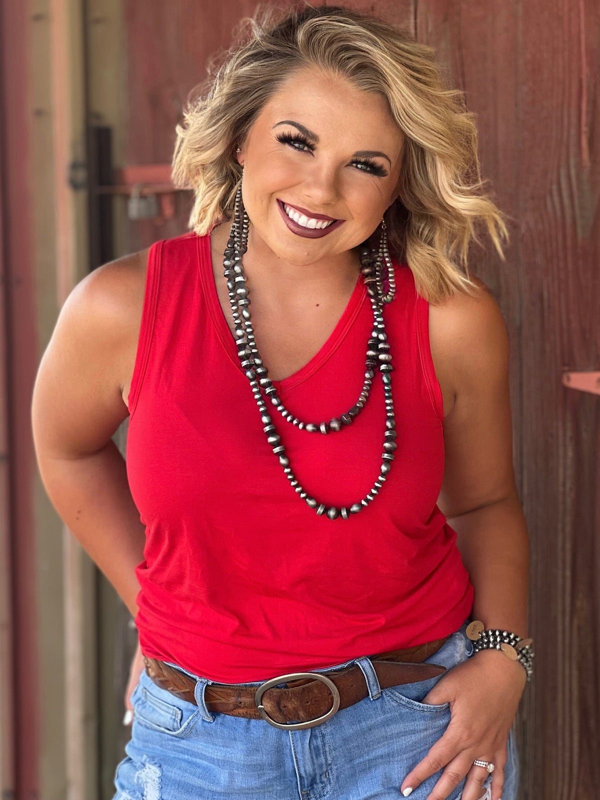 White Jules V-neck sleeveless top by Texas True Threads, showing a close-up of the stylish, lightweight sleeveless blouse.